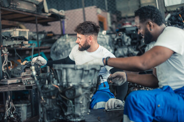 Fototapeta na wymiar Car technician check engines, choose quality gear for precise repairs to ensure optimal performance