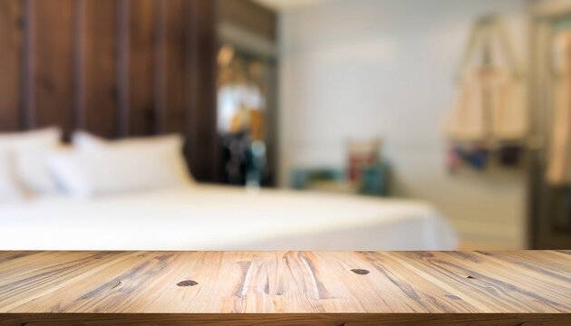 Wood table top and blurred bedroom background - can used for display or montage your products.
