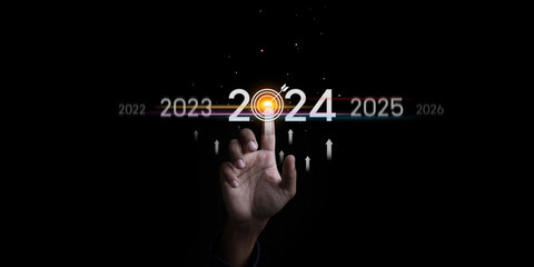 Countdown to 2024 concept. the taps a virtual download bar with a loading progress meter on New Year's Eve, turning the year 2023 to 2024. - obrazy, fototapety, plakaty