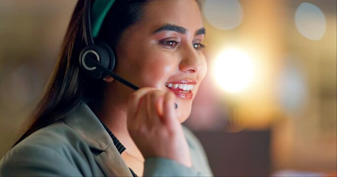 Call center, woman and happy communication at night in office for customer service, CRM advisory and consulting. Face, indian agent and questions for telecom support, contact and telemarketing advice