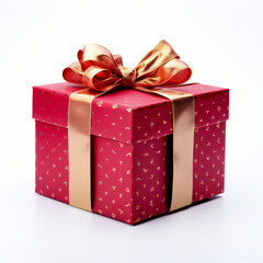 A red gift box with white polka dots and a shiny gold ribbon bow isolated on a white background