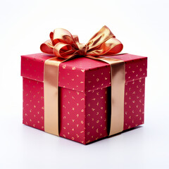 Obraz premium A red gift box with white polka dots and a shiny gold ribbon bow isolated on a white background