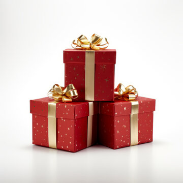 A festive image of three red gift boxes with gold bows, stacked isolated on a white background