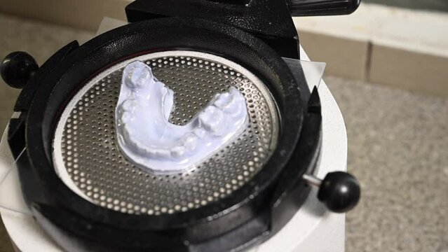 Mouth guard for teeth, printed on a 3D printer in dental clinic laboratory. 4k cinematic slow motion video