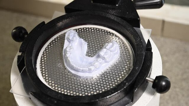 Mouth guard for teeth, printed on a 3D printer in dental clinic laboratory. 4k cinematic slow motion video