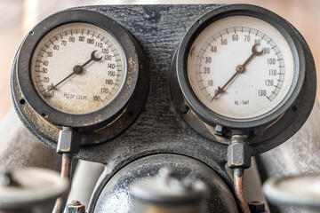 The historical pressure gauges on the torpedo service system, close up.