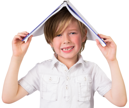 Digital png photo of happy caucasian boy with notebook on head, smiling on transparent background