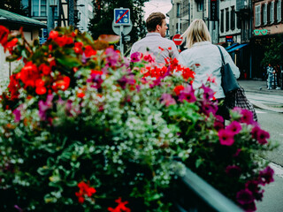 Floral Splendor: Urban Couple Amidst Cityscape