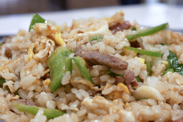 One side of fried rice on table inside restaurant