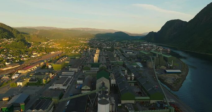 Aerial view over Mosj&oslash;en industrial aluminium plant during midnight sun, Norway
