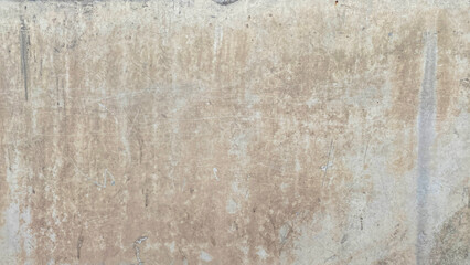 Dirty concrete wall with chips. The scratched, battered, dilapidated wall of the building.