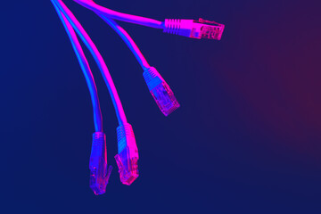 Modern technology network cable in neon light.
