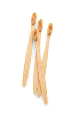 Many bamboo toothbrushes on white background