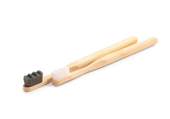 Bamboo tooth brushes on white background
