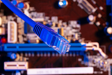 Modern technology network cable in neon light.