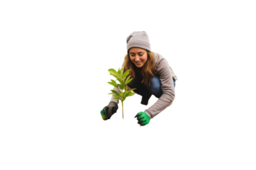 Happy female volunteer planting trees for growth. Ecology