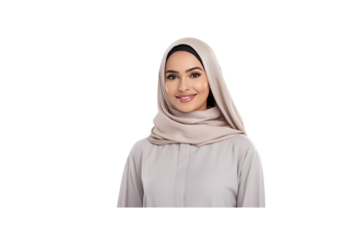 Young Emirati woman wearing traditional dress smiles and looks at the camera.