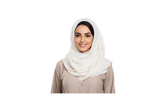 Young Emirati woman wearing traditional dress smiles and looks at the camera.