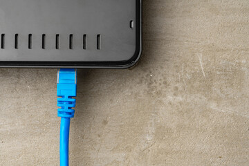 Modern router with cables plugged in close up