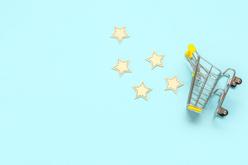 Shopping cart with five stars rating on blue background. Customer experience concept