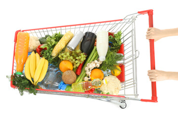 Woman pushing shopping cart full of food isolated on white background © Pixel-Shot