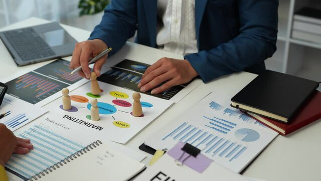 Business planning for marketing work, placing people, allocating employees in each department to work. with project planning documents on the conference table Human resources management concept.