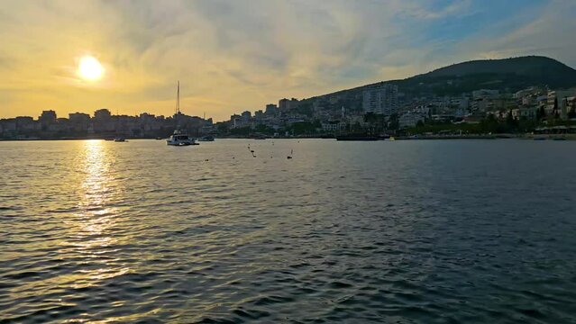 Saranda Sunset Timelapse: Coastal City's Bay Transforms Under the Golden Glow, Revealing the Tranquil Beauty of Ships in Port