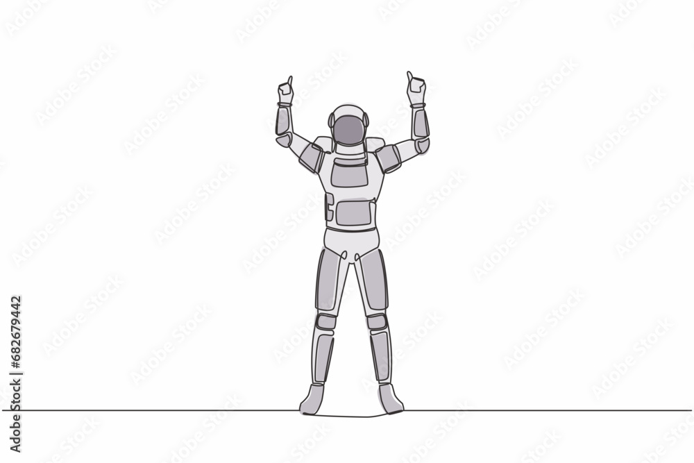 Poster single continuous line drawing happy astronaut standing with both hand pointing index finger up. cel