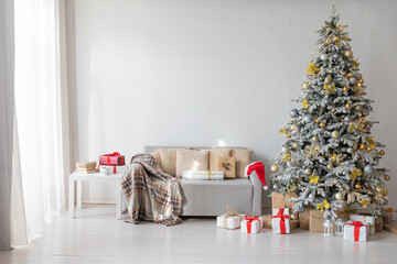Christmas tree with gifts decorated with toys for new year