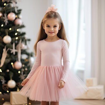 cute little girl ballerina wearing a pink long sleeve tutu