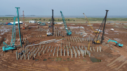 Piling Foundation work near the sea. Large construction area.