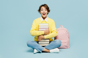 Full body surprised excited happy fun young woman student wear casual clothes sweater backpack bag...