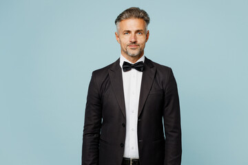 Adult serious Caucasian barista male waiter butler man wear shirt black suit bow tie elegant...