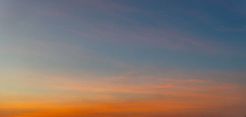 Naklejka na ściany i meble Sunset sky above with dramatic light at evening time.