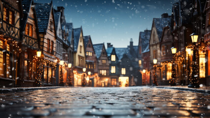 Glistening cobblestone street of a festive old town as snow gently falls in the evening