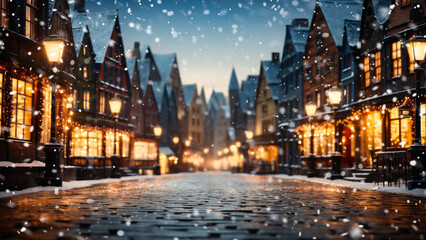 Glistening cobblestone street of a festive old town as snow gently falls in the evening - obrazy, fototapety, plakaty