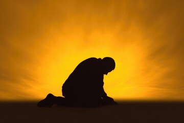 Christian prayer. Man on his knees praying on sunset background. Kneeling prayer to God. Worship and praise. - obrazy, fototapety, plakaty
