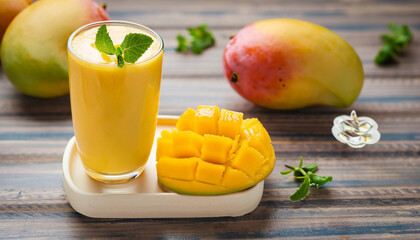 fresh mango smoothies - healthy food and drink concept