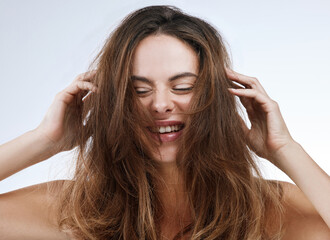 Hair care, woman or face and smile in studio with hands, collagen treatment or shampoo for waves....