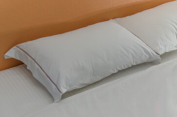 White pillows on white sheets.