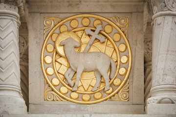 Fresco with a lamb and a cross painted with gold on a statue of King Saint Stephen in Fisherman's...