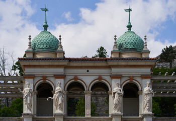 Domes and statues on a facade of Varkert Bazar (Hungarian: Várkert Bazaar or Várbazár) building. Budapest, Hungary - 7 May, 2019