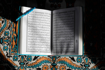 Kuran on a prayer mat