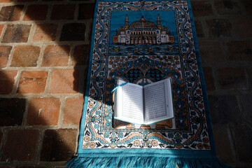 Kuran on a prayer mat