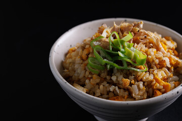Japanese fried rice yakimeshi isolated in black background