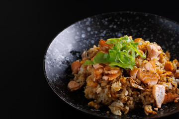 Japanese fried rice yakimeshi isolated in black background