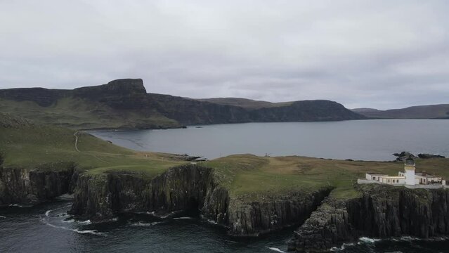 Drone view of Neist Point. Stunning coastal location on the Isle of Skye in Scotland, known for its dramatic cliffs and iconic lighthouse. Cinematic video