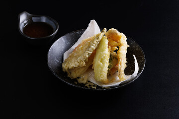 Mix tempura with shrimp fish and vegetable Japanese food isolated in black background