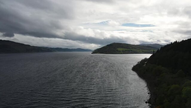 Aerial view of Loch Ness in Scotland. The atmosphere is serene and the stillness of the lake gives it an air of mystery, with the possibility of spotting the legendary Loch Ness Monster.