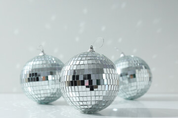 Beautiful disco balls on a light background